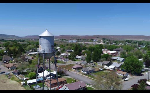 An aerial image of a water tower and city